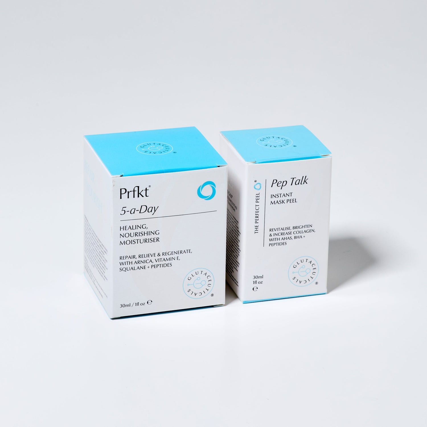 Two skincare product boxes from Prfkt on a light grey background