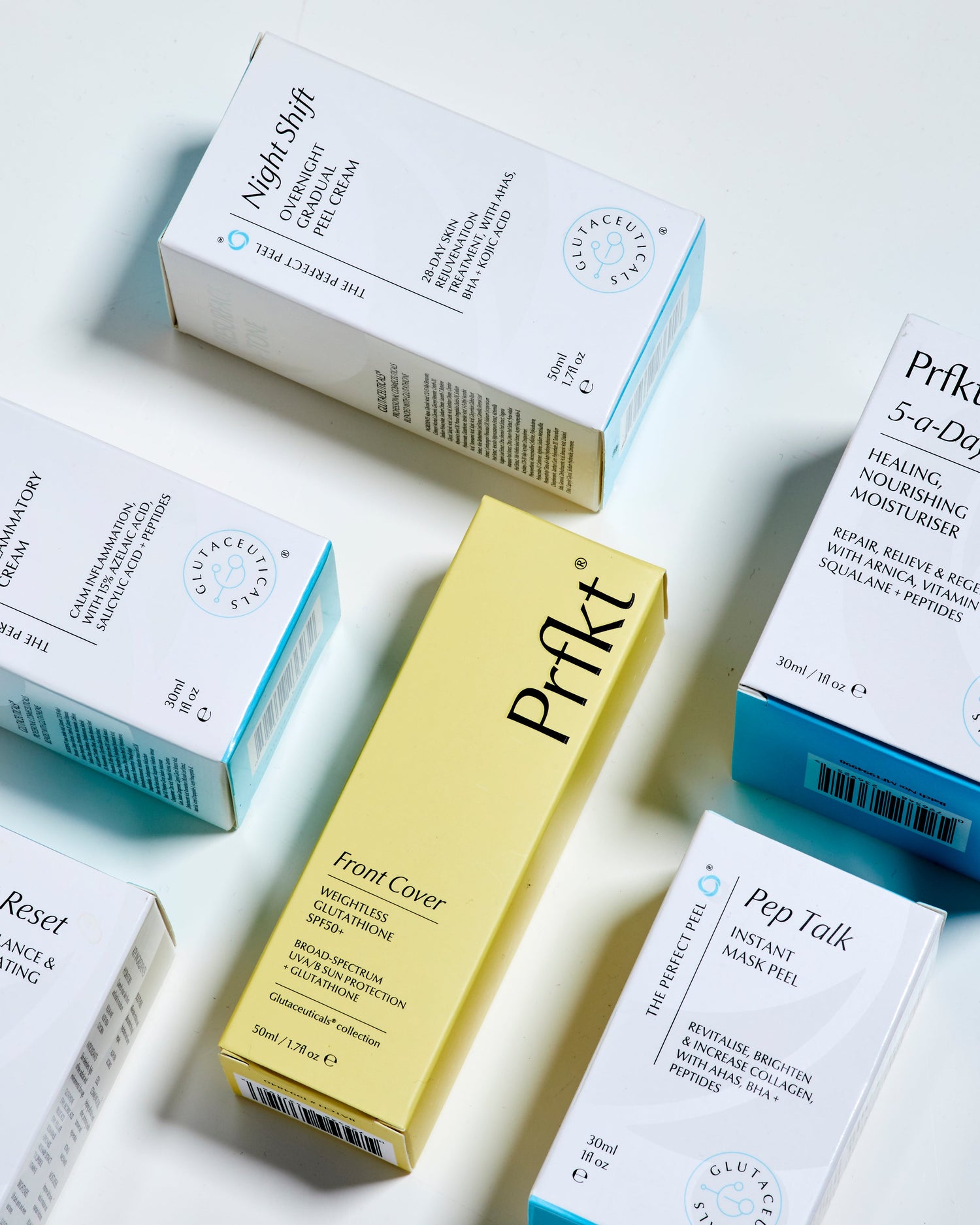 Collection of skincare product boxes on a light background